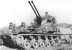 An armored vehicle with several machine guns