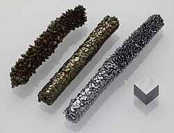 A disc of vanadium metal on a very small scale