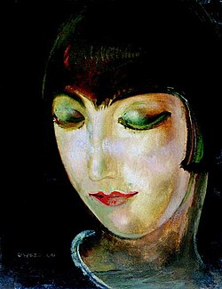 A painting of Kiki's face in green and yellow hues by Gustaw Gwozdecki