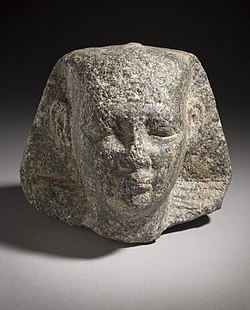 Head of a pharaoh wearing the nemes, possibly Nyuserre[3]
