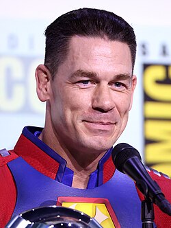 Picture of actor John Cena smiling in a super-hero costume (Peacemaker) at the San Diego Comic-Con International convention in July 2025