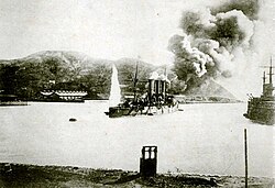 Pallada under fire as the Oil Depot burns