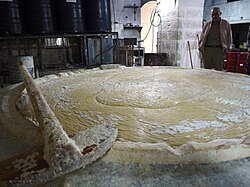 The cooking of ingredients is done by Al Tabbeekha or the cooks.[22] Photo at the Shaka'a factory.