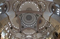 The Şehzade Mosque (1543–8) combines a central dome supported by four pillars and four semi-domes.[101]