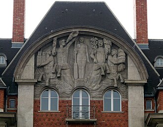Art Deco pediment of the Carrefour Curie (Quai de Conti no. 1-3), Paris, by Joseph Marrast and Charles Letrosne, 1932[28]