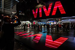 An image of the entrance to Vivatech 2019, showing a large VIVA logo and a crowd of people