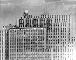 Black-and-white image of the top floors with RCA wordmark