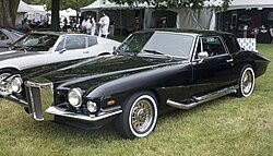 A black Stutz Blackhawk automobile parked on grass.
