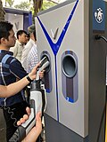 SAE J1772 plugs operated by thumb at a VinFast charging station
