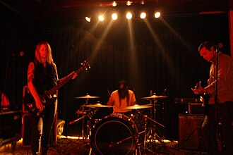 True Widow performing live in Berlin in 2010. From left to right: Nicole Estill, Timothy Starks and Dan Phillips.