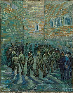 In an indoor prison yard a large group of men walk in a circle, one behind the other. The face of the prisoner in the centre of the painting and looking toward the viewer looks like van Gogh.