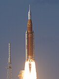 The two boosters being ignited, sending Artemis II into space.