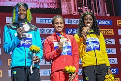 Three athletes collect their medals