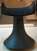 A polished basalt breadfruit pounder