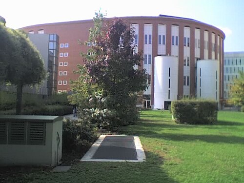 Full view on the ellipsoid Velodromo building, as seen from EGEA
