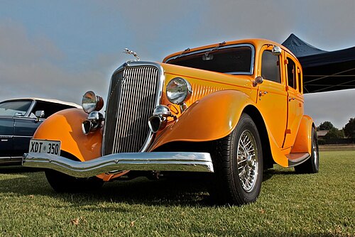 Somewhat milder tuned street rod without chopped top, based on 1934 Model 40B or B Fordor, claimed a Deluxe. The usual mixing parts in this genre avoids clear identification