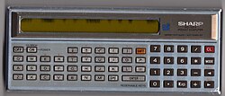 Sharp PC-1211. This example exhibits a display that is failing, a very common problem with Sharp's displays of the time.