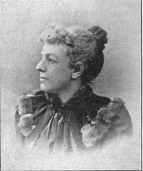 19th-century B&W portrait photo of a woman with her hair in an up-do, wearing a dark, fitted blouse.