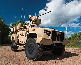 Oshkosh L-ATV in M1278 Heavy Guns Carrier JLTV configuration and fitted with an EOS R-400S-MK2 remote weapon system integrated with Orbital ATK's M230 LF 30 mm lightweight automatic chain gun