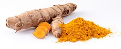 Photograph of knobby brown rhizome and orange powder