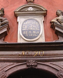 Inscription over the front door of 20 quoting Psalm 37:5 in German: "Befiehl dem Herrn deine Wege und hoffe auf ihn, er wirds wohl machen". English translation: "Commit thy way unto the Lord; trust also in Him, and He will bring it to pass."