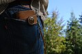 A large wallet attached with a leather cord or magnet