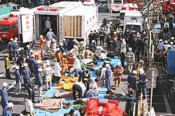 Large-scale rescue operations with an expandable special ambulance deployed.