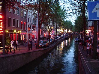 The red-light district in Amsterdam (2003). Red is the sex industry's preferred color in many cultures, due to being strongly associated with passion, love and sexuality.: 39–63