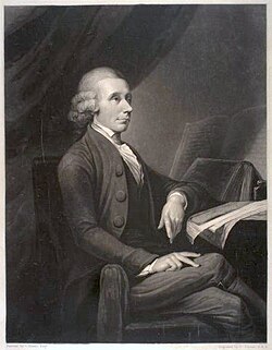 A drawing of an elderly man sitting by a table and facing parallel to the drawing. His left arm rests on a notebook, legs crossed.