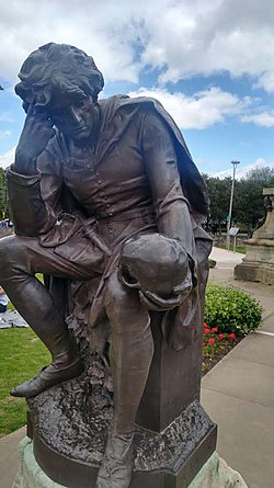 Photo showing a statute of Hamlet holding a skull, from the famous 'Alas poor Yorick' scene.