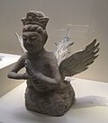 A winged kalavinka made of grey pottery