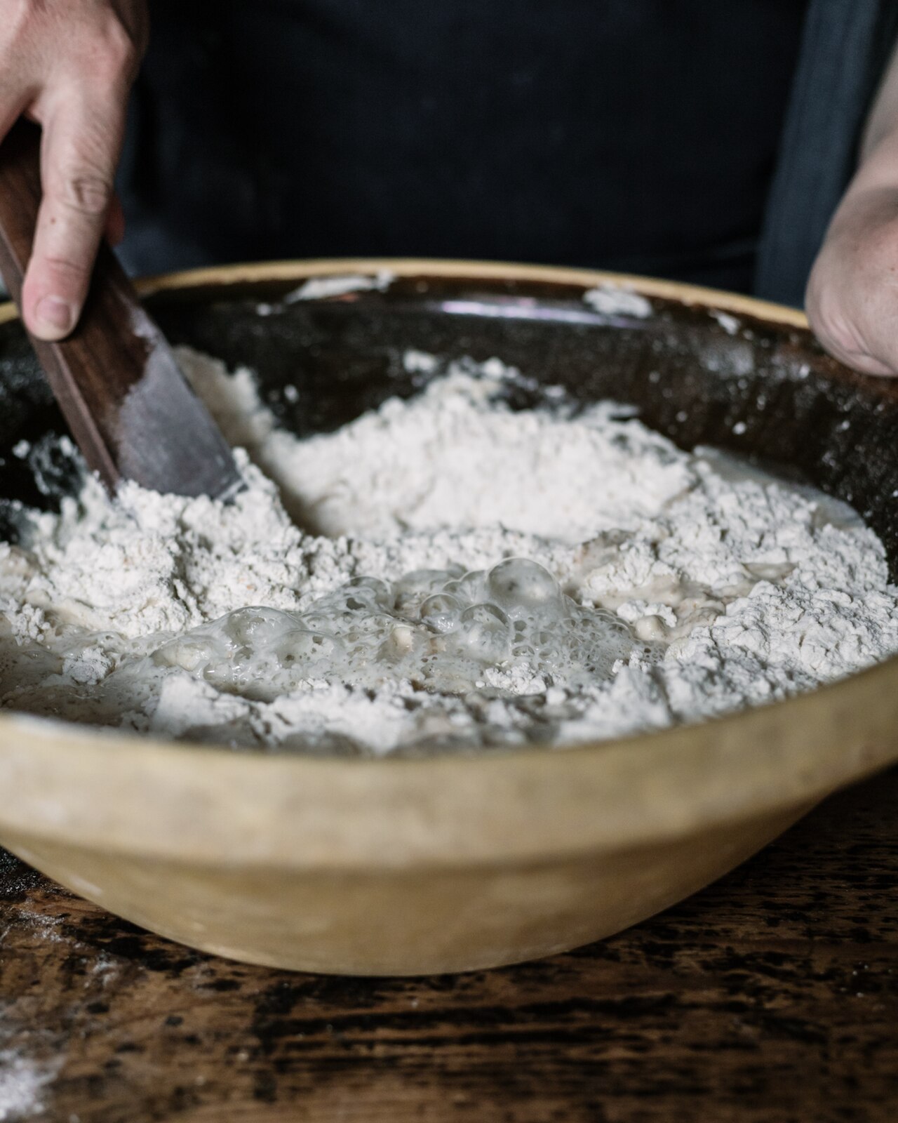 Mixing Sourdough starter into the flour.jpg