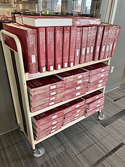A picture of printed LCSH schedules on a cart.