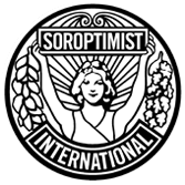 A circular, black and white logo with a style suggesting late Art Nouveau or early Art Deco. Soroptimist International describes it as follows: "The emblem consists of a circular disc on which the figure of a woman holds the banner 'Soroptimist' in uplifted arms, spreading sunrays from the background. [From] the banner on one side fall acorns and leaves of oak and on the other side, leaves of laurel. [The] word 'International' completes the outer circle."[1]