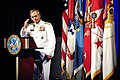 Admiral Eric T. Olson salutes Sergeant First Class Leroy Petry at a ceremony at The Pentagon.