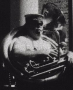 Jaffe seen at left playing bass horn behind Olympia Brass Band grand marshal "King" Richard Matthews at "jazz funeral", 1981