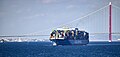 A container ship moving south past 1915 Çanakkale Bridge in 2024