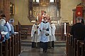 Evangelical-Lutheran acolytes (with the thurifer and torchbearers in the center) prepare for the Gospel Reading during High Mass at Holy Trinity Church in Uppsala on the Feast Day of the Apostles Philip and James the Less