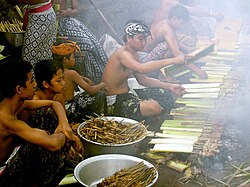 Balinese preparing food for eating