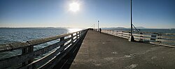 View along the concrete deck of Berkeley Pier toward the open bay