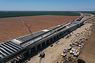 California High-Speed Rail crews are tying rebar to form the deck on the northern and southern portions of the pergola at the Wasco Viaduct – June 2022. (The railway angles across the top of the pergola.)