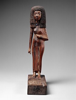 Statuette of the lady Tiye; 1390-1349 BC; wood, carnelian, gold, glass, Egyptian blue and paint; height: 24 cm; Metropolitan Museum of Art