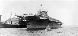 Black and white photograph of a ship in port