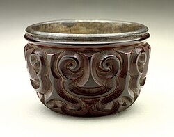 Bei (Cup) with guri Sword-Pommel Pattern, in tixi, with silver interior. Song or Yuan. Straight sides to grooves, and several thin layers of red.