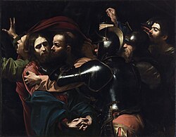 Judas kisses Jesus, and soldiers rush to seize the latter.