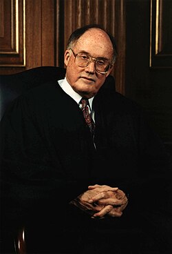Rehnquist seated in robes