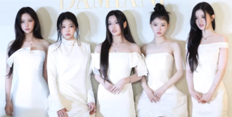Illit in white dress in January 2026