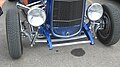 Deuce coupe featuring '32 grille shell, original headlights, chrome dropped I-beam axle and tube shocks. Note stock frame rails, disc brakes, Lakester pipes[58]