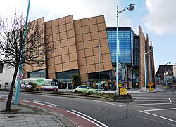 Shopping centre façade with diagonal cladding panels