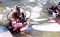 Two divers wearing dry suits